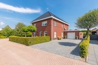 Historische woningfoto van Nicolaas Emmenstraat 1, Wildervank uit 2023