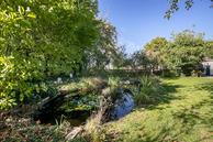 Historische woningfoto van Oosterstreek 54, Oosterstreek uit 2022